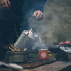 Kelly Kettle Scout Whistle Kettle - 1.2 L 12 Kelly Kettle Scout Whistle Kettle - 1.2 L -Outdoor Sports Equipment Store kelly kettle pouring a brew.jpg Good2goco
